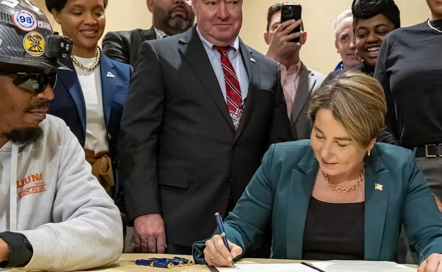 Massachusetts Gov. Maura Healey signs a PLA order