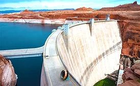 Glen Canyon Dam with low Lake Powell water levels visible upstream.