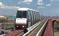 EWR-AirTrain AirTrain Newark vehicle on elevated guideway at Newark Liberty International Airport.
