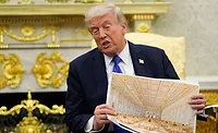 President Donald Trump holds an artist rendering of interior of the new White House ballroom.