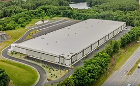Aerial view of a large logistics warehouse in Merrimack, N.H., proposed for federal adaptive reuse.