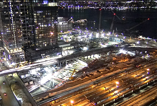 Night aerial of Hudson Tunnel Project construction site.