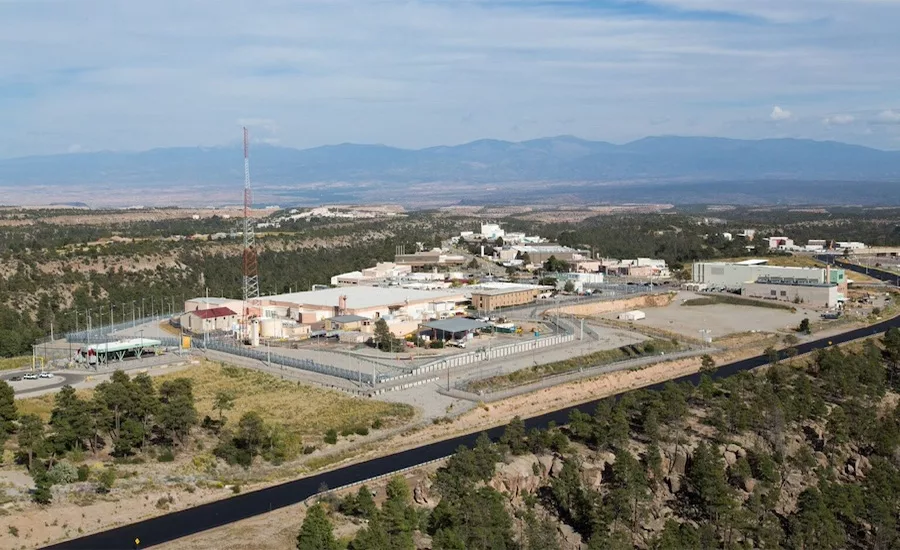 A giant federal nuclear research complex in New Mexico, with a history of WW2 and Cold War bomb component production, faces new state enforcement for delaying radioactive and chemical waste cleanup.