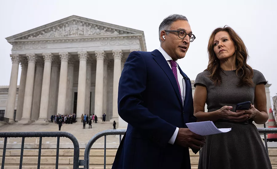 Attorney Neal Katyal and Liberty Justice Center Chair Sara Albrecht give an interview outside the U.S. Supreme Court building after the court struck down President Donald Trump's sweeping tariffs in Washington, D.C., Feb. 20, 2026.