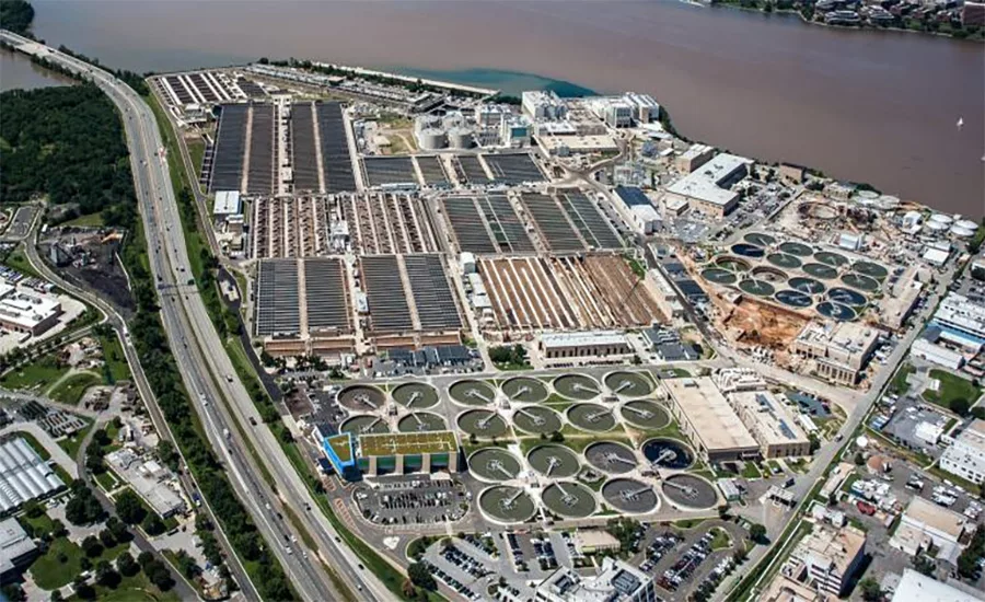 Aerial view of DC Water’s Blue Plains wastewater treatment plant with circular clarifier basins along the Potomac River.