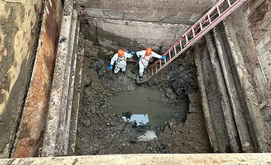 contractors’ efforts to clear the damaged section and begin repairs
