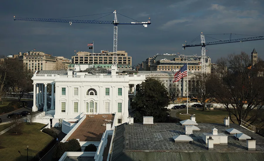 The White House with construction cranes visible behind the complex as excavation continues on the planned State Ballroom ahead of a March 5 federal planning vote.