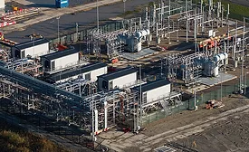 High-voltage electrical substation with transformers, switchgear and buswork supporting transmission grid infrastructure.