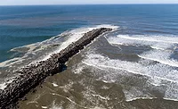 Aerial view of the Grays Harbor North Jetty extending into the Pacific Ocean.