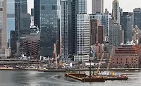 Barges and cranes work in the Hudson River near Manhattan during construction of the Gateway Hudson Tunnel Project.