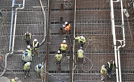 Workers installing rebar and pouring concrete for Hudson Yards tunnel casing project