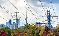 High-voltage power lines with Toronto skyline in background
