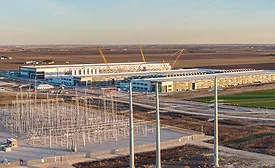 Electrical infrastructure and data center construction site in Hutto, Texas. data center under construction beside electrical transmission infrastructure.