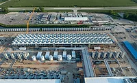 AI-Bill Aerial view of cooling systems under construction at Microsoft's Fairwater data center in Mount Pleasant, Wis., supporting AI and cloud computing operations.