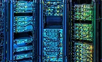 Generic Data center Servers ENRwebready.jpg Image of data center serves lit in blues, greens and yellows