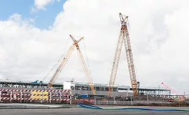 Large cranes tower over a hyperscale data center campus as construction continues on additional buildings at Meta's Mesa, Ariz., facility.