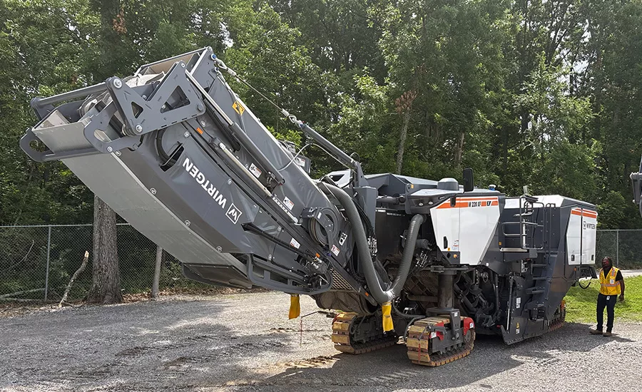 Wirtgen W 220 XF cold milling machine displayed during a John Deere roadbuilding technology demonstration near Nashville, Tennessee.