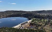 Aerial view of Leslie Dam near Warwick, Queensland, showing the reservoir and concrete spillway.