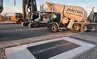Micron-Concrete Construction equipment and a commemorative slab marking Micron's July 2026 concrete placement in Clay, N.Y.