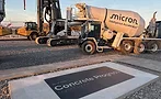 Micron-Concrete Construction equipment and a commemorative slab marking Micron's July 2026 concrete placement in Clay, N.Y.