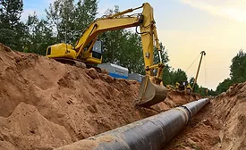 A photo of a crew laying a gas pipeline