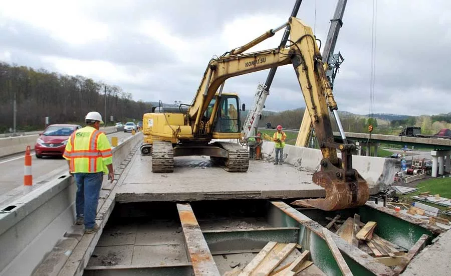 Crew demolishes a bridge deck