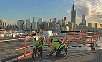 Workers from the Helm Group prepare roof openings