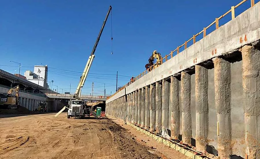 Crews construct a wall