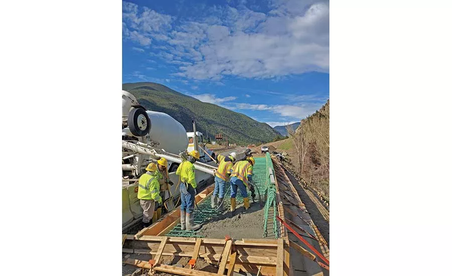 Crews place a concrete anchor