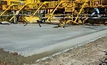 Crews pave a road segment in St. Louis, Mo.