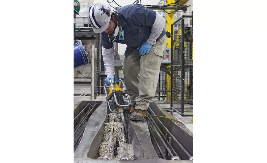 Worker prepares concrete mix