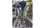 Worker prepares concrete mix