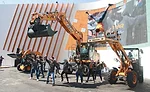Break dancers draw crowds to Case Construction booth