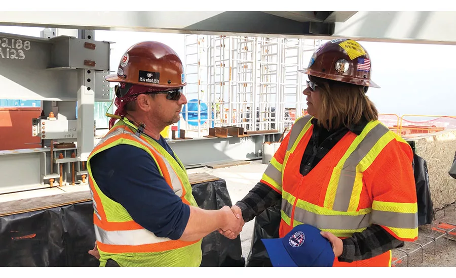 Vicki O’Leary shaking hands