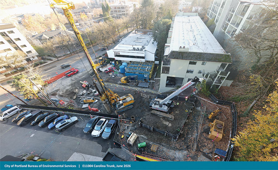 Carolina Trunk Project crews and machinery working next to businesses