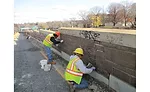 replacing stones in Union Turnpike retaining wall