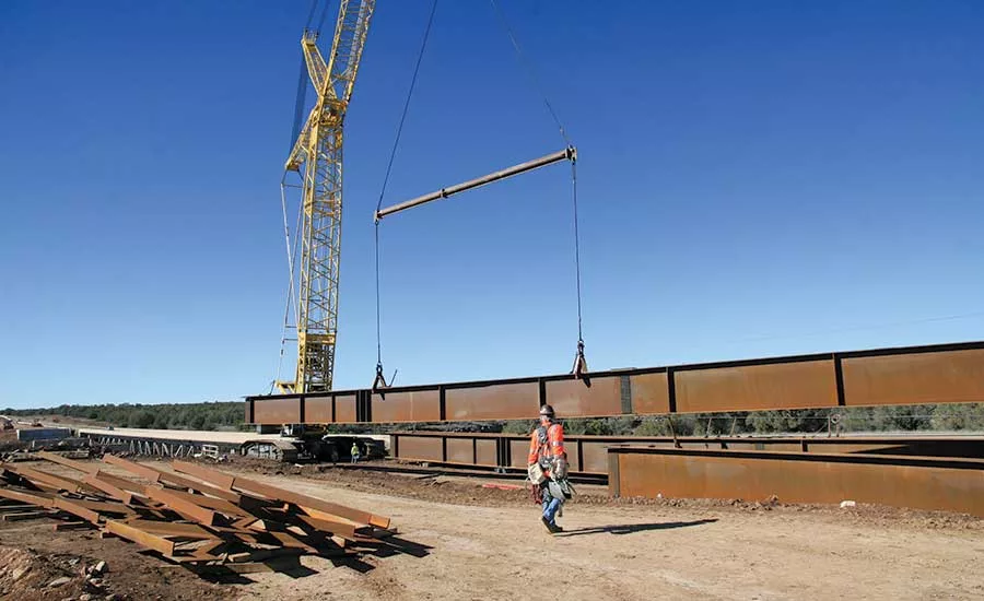girder lifted from staging area
