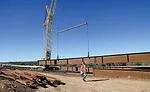 girder lifted from staging area