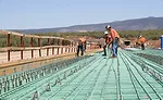 workers pulling rebar