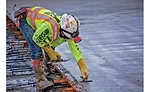 Workers place concrete