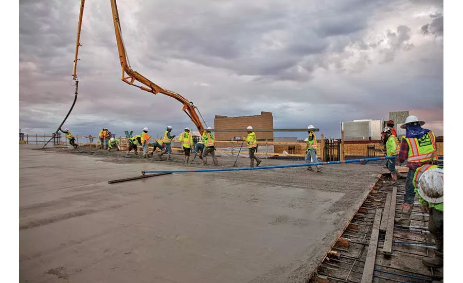 Workers place concrete