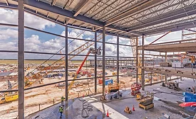 Crews advance steel and enclosure work