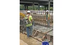 Workers pour a concrete