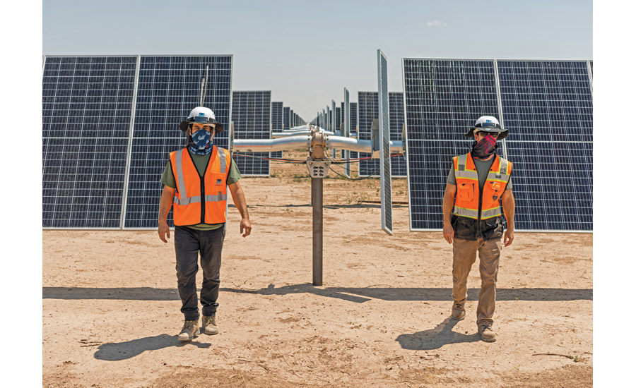 construction workers and solar panels