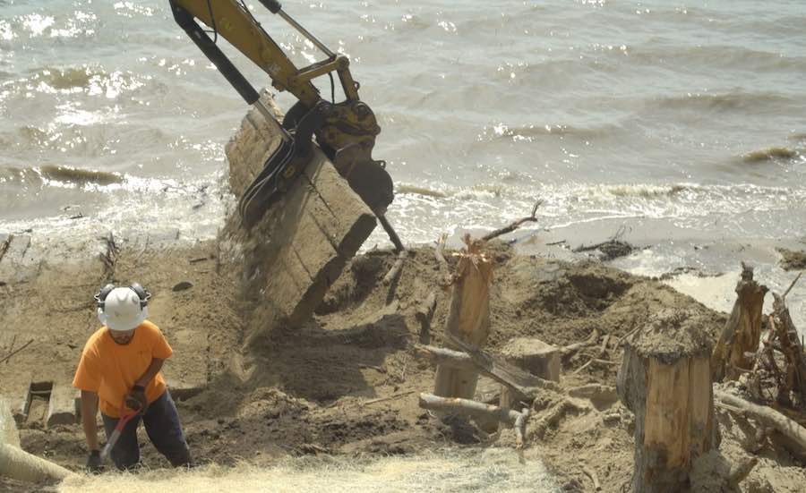 A crew works on a living shoreline in Maine