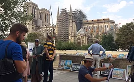 man watches notre-dame.jpg
