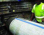 Broadband Electromagnetic Scanning Reveals The Inner Secrets of a Pressurized Sewer Line
