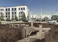 Pipes in the ground shown with building in the background