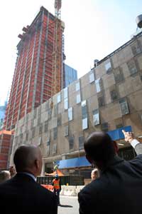 Tishman (R) and Vickers tour the 22-story InterContinental New York Times Square hotel on West 44th Street. The firm's development arm, Tishman Hotel & Realty, is developing the project. (Photo by Michael Falco)