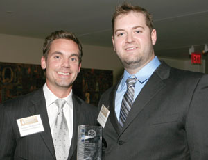 Brennan McReynolds (left) and Joe Hammerstrom of Skanska USA Building show off their award for the Lincoln Memorial East Plaza Barrier System at the AGC of DC&rsquo;s Ninth Annual Washington Contractor Awards Program.